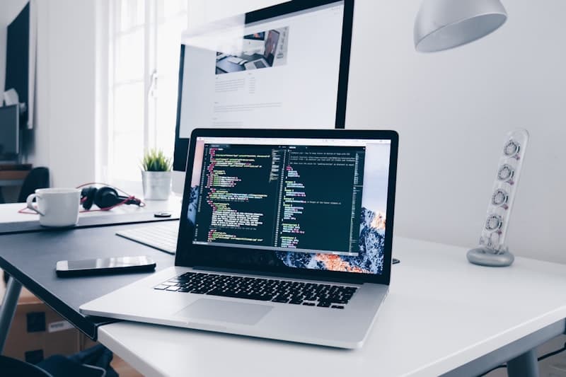 Developer working on laptop with coffee