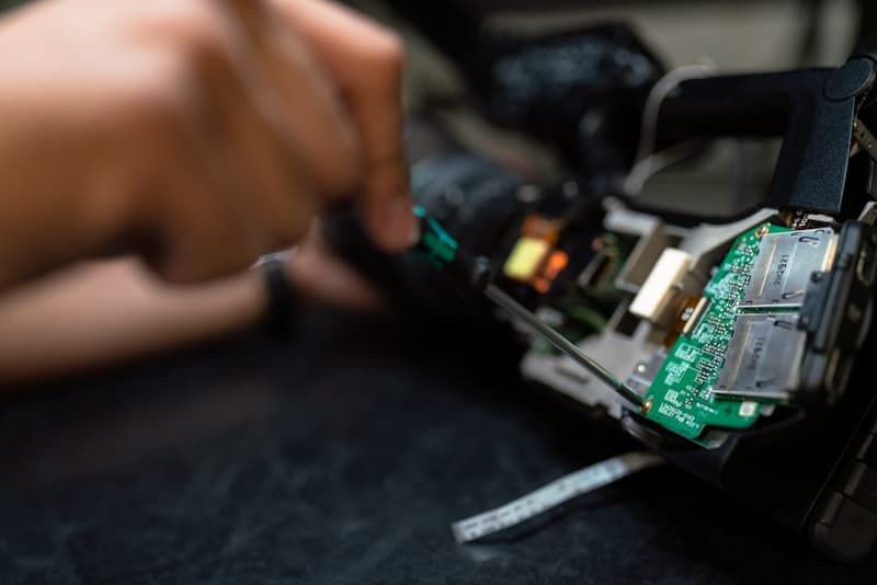 Smartphone with back cover removed during repair