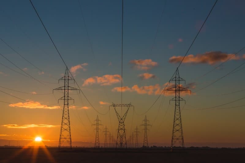 Power lines and sunset sky